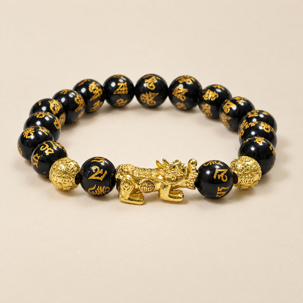 Om Mani Padme Hum bracelet, black engraved beads with gold-tone Pixiu charm