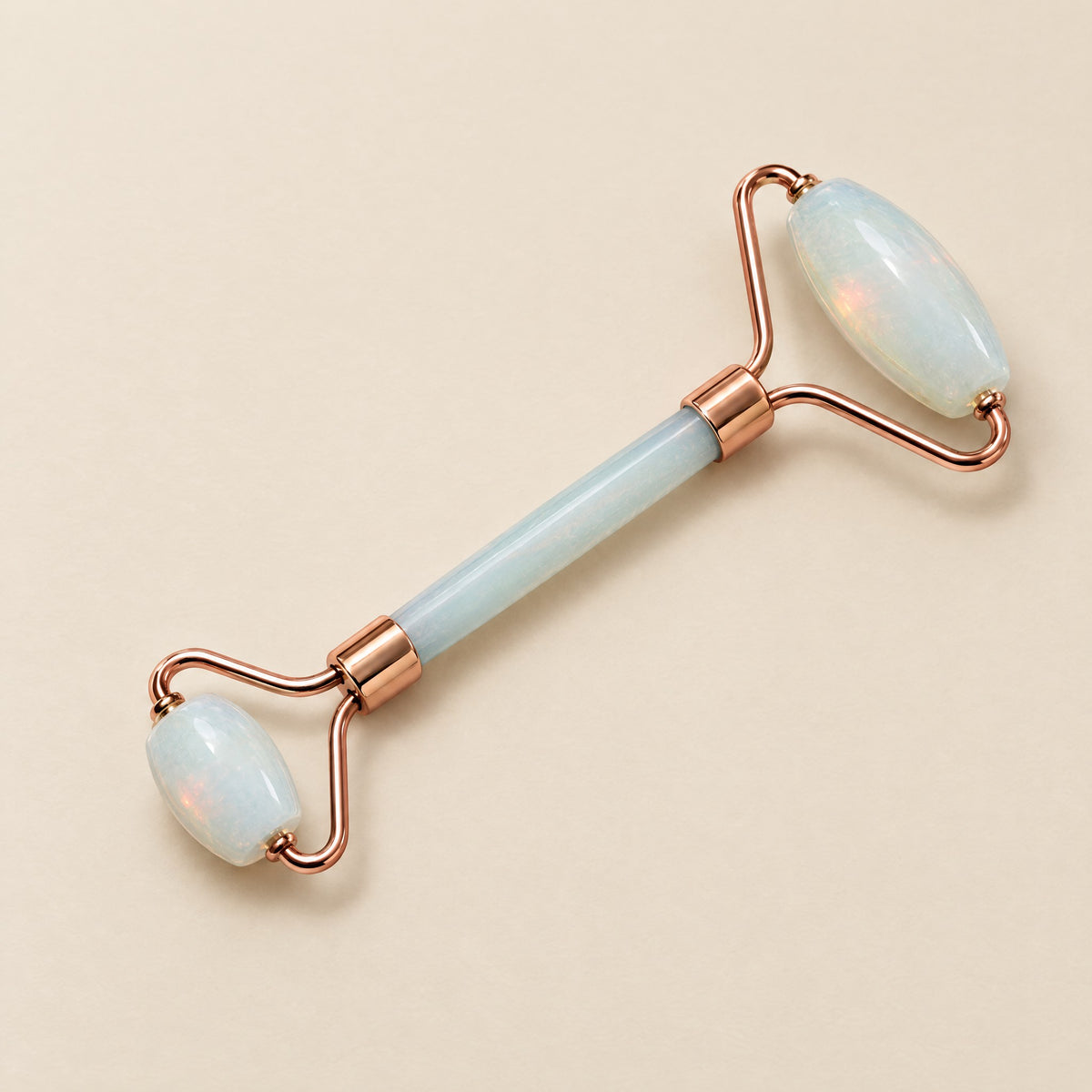 Opal face roller with rose-gold-tone frame