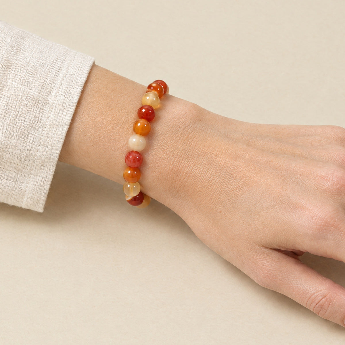 Carnelian bracelet worn on a woman's wrist