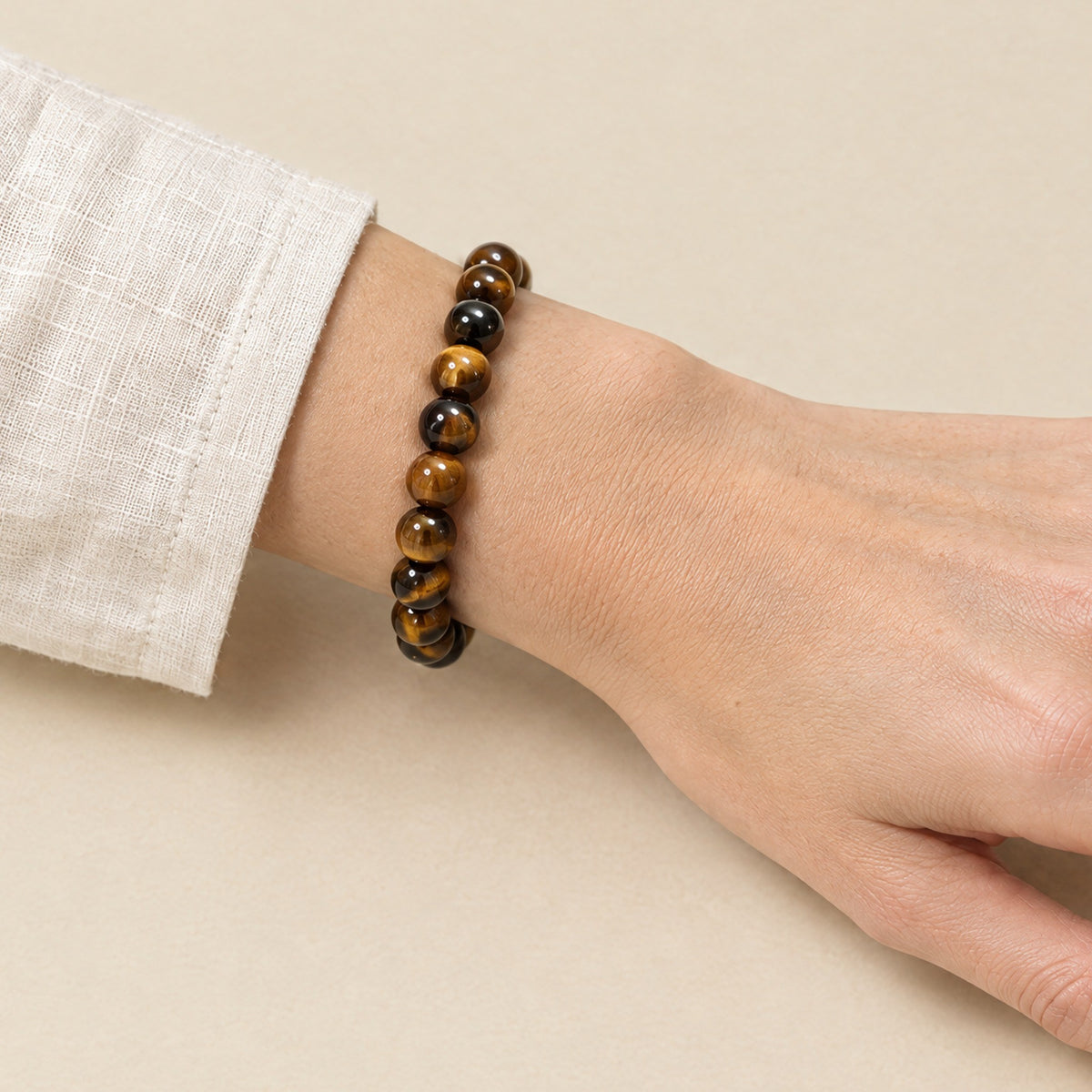 Tiger eye bracelet worn on a woman's wrist