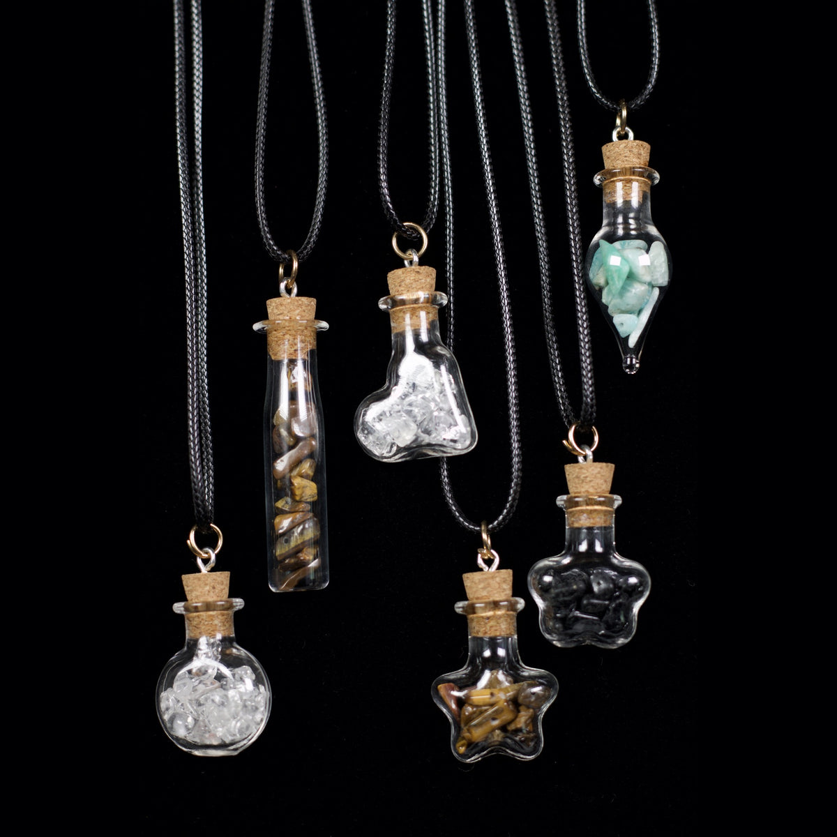 Unedited photo of all six wish bottle necklaces in stock