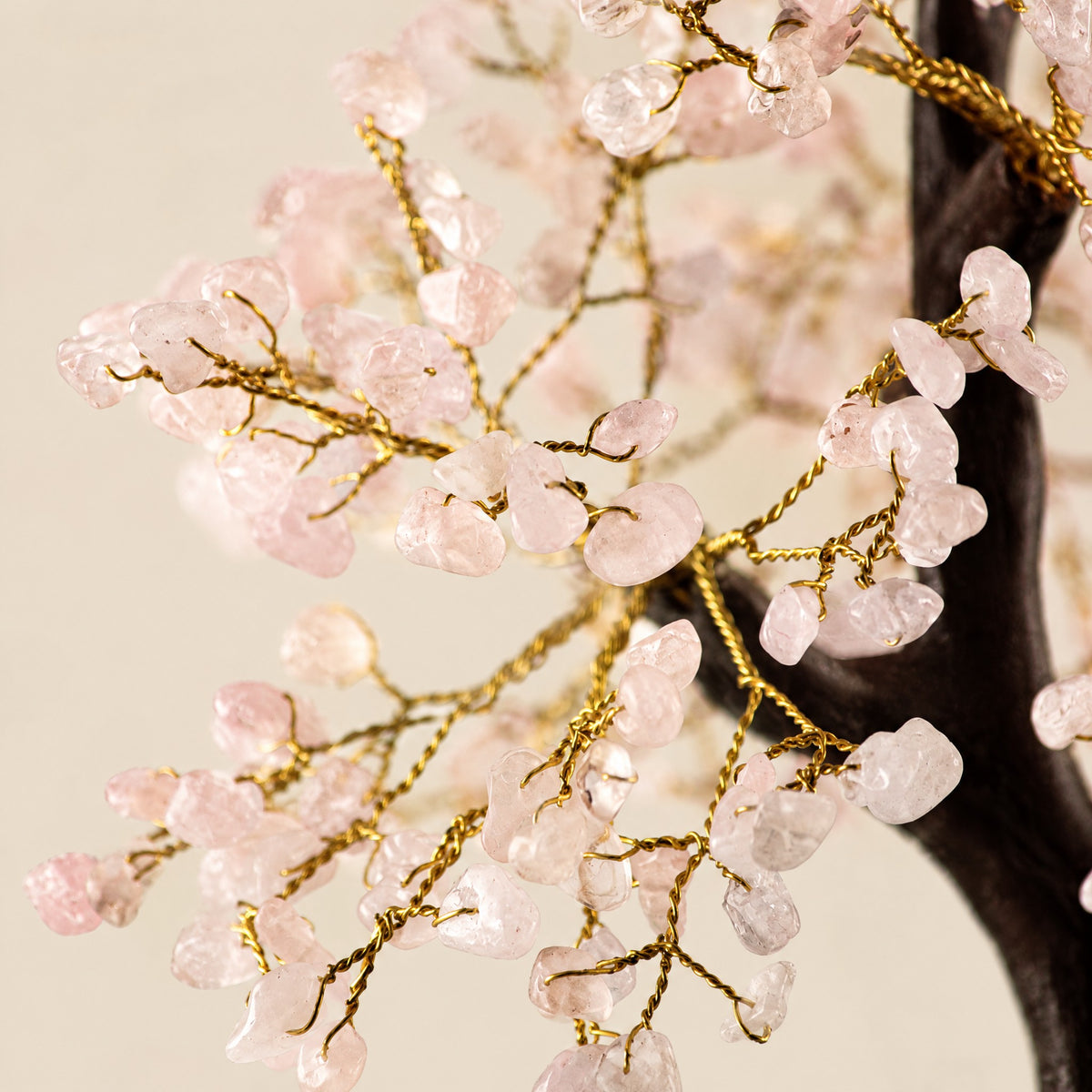 Close-up of the rose quartz chips on gold-tone wire branches