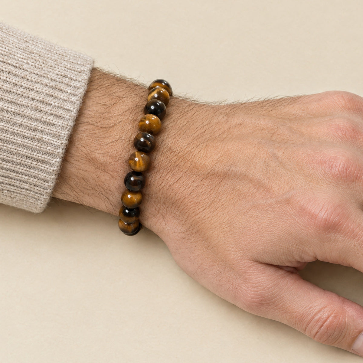 Tiger eye bracelet worn on a man's wrist