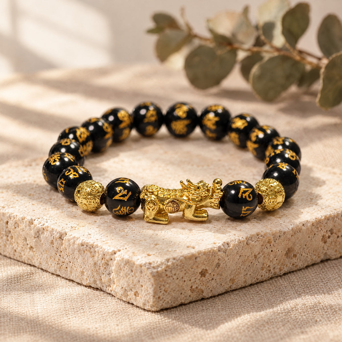 Om Mani Padme Hum bracelet on a travertine stone