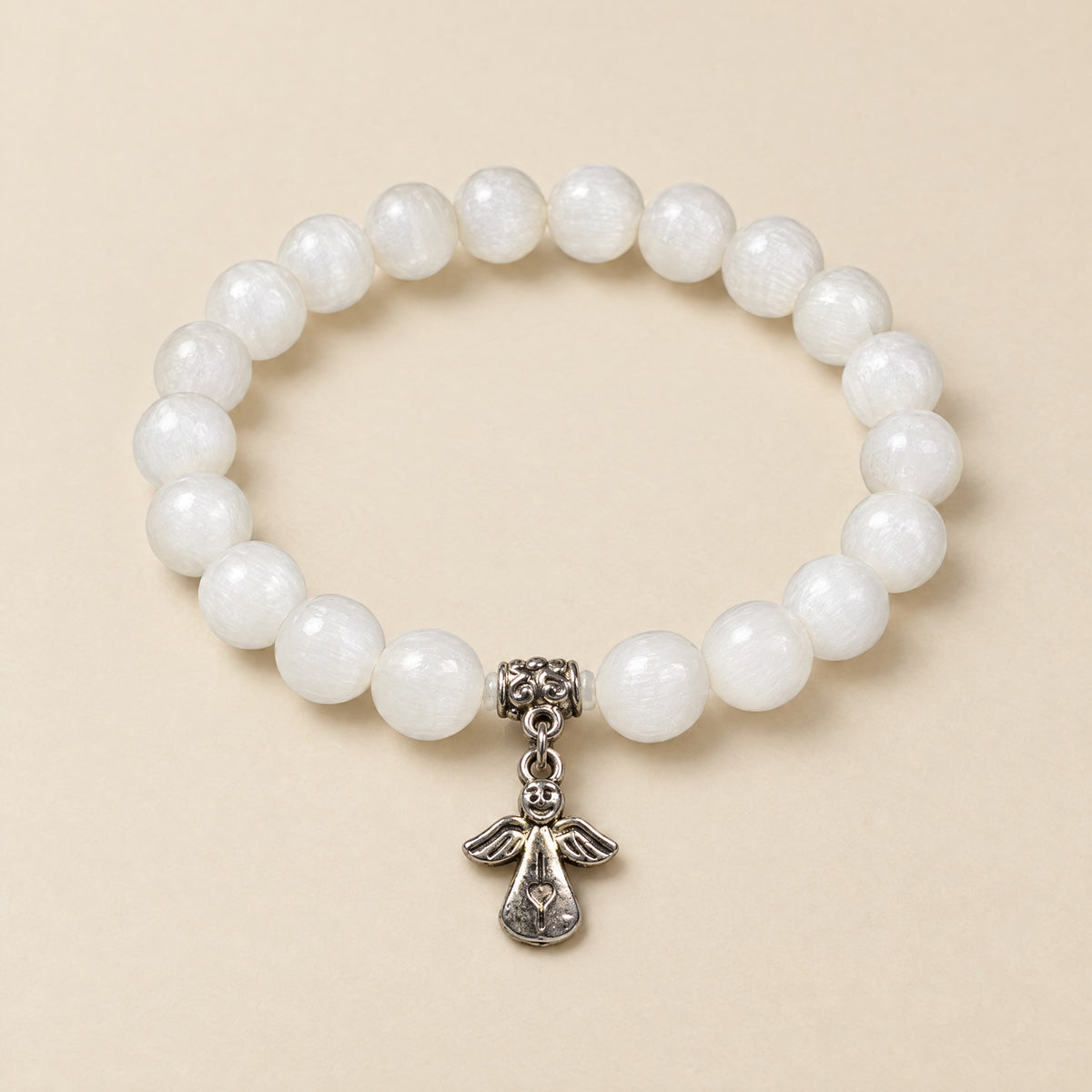 Guardian Angel Bracelet: 8 mm selenite beads with a silver-tone guardian angel charm