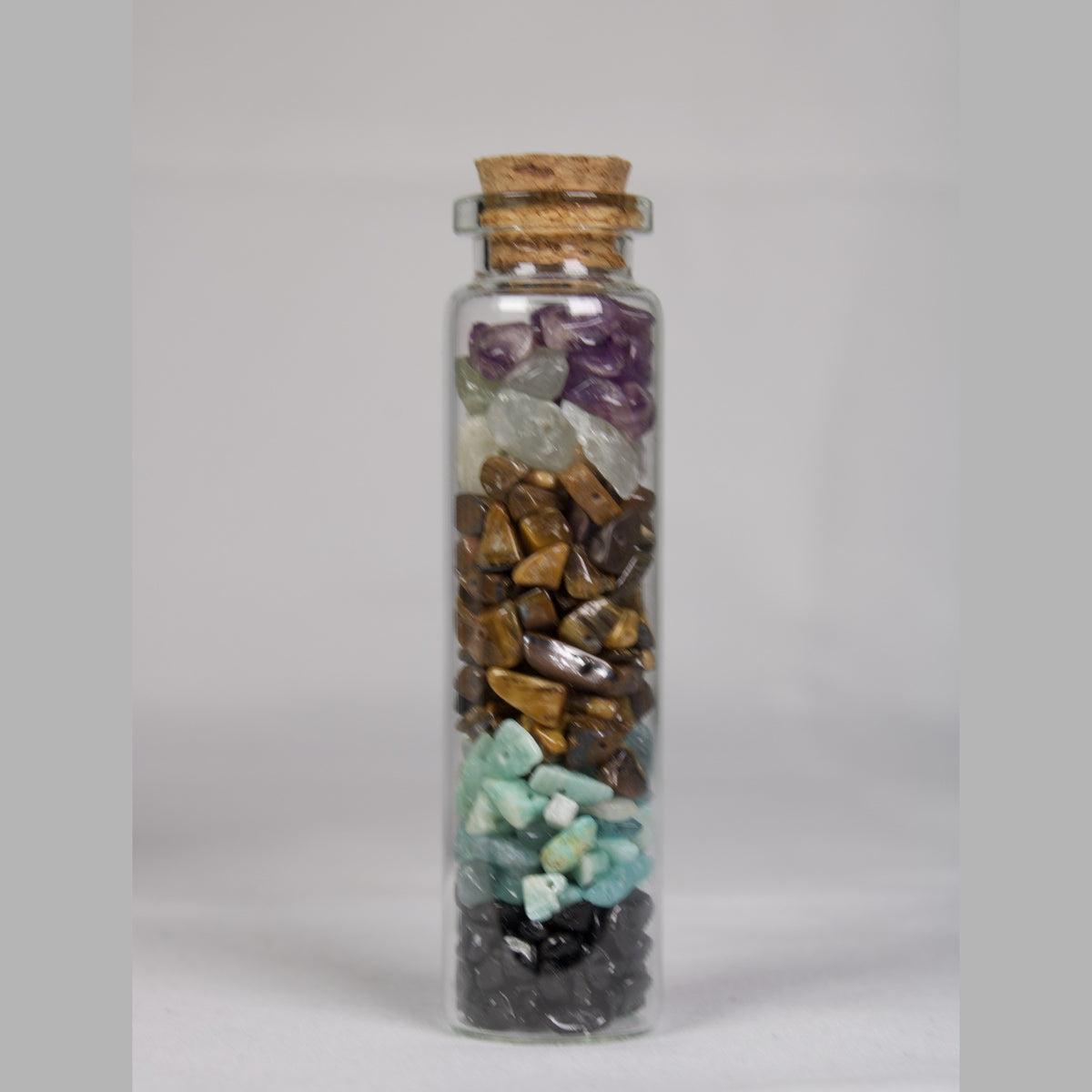 Crystal intention jar for Balance: layered amethyst, tiger eye, amazonite and black tourmaline