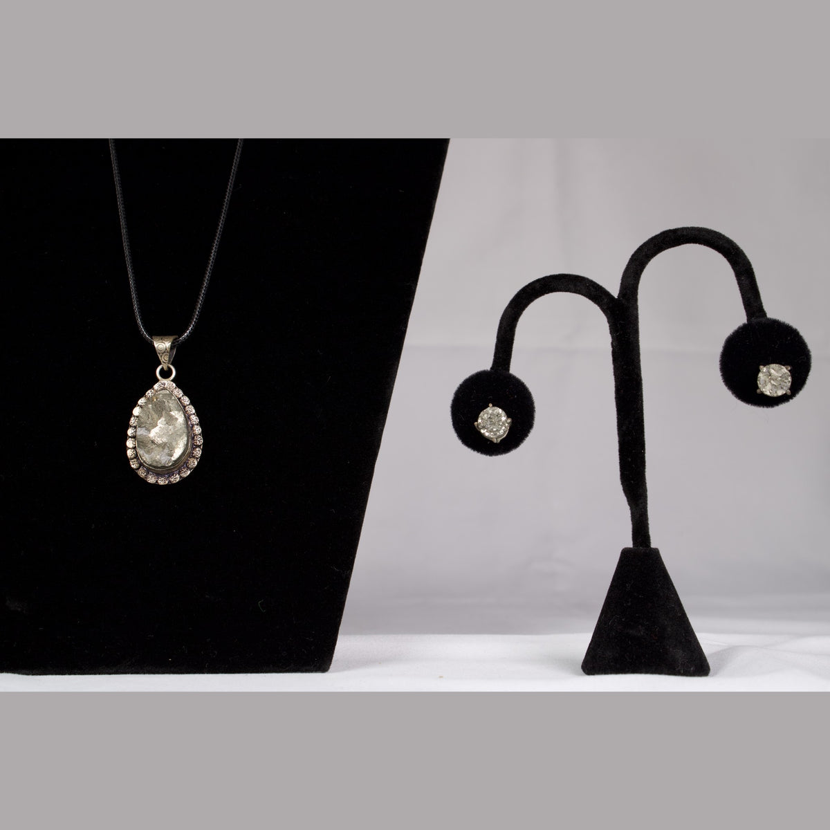 Unedited photo of the pyrite stud earrings with the matching pendant