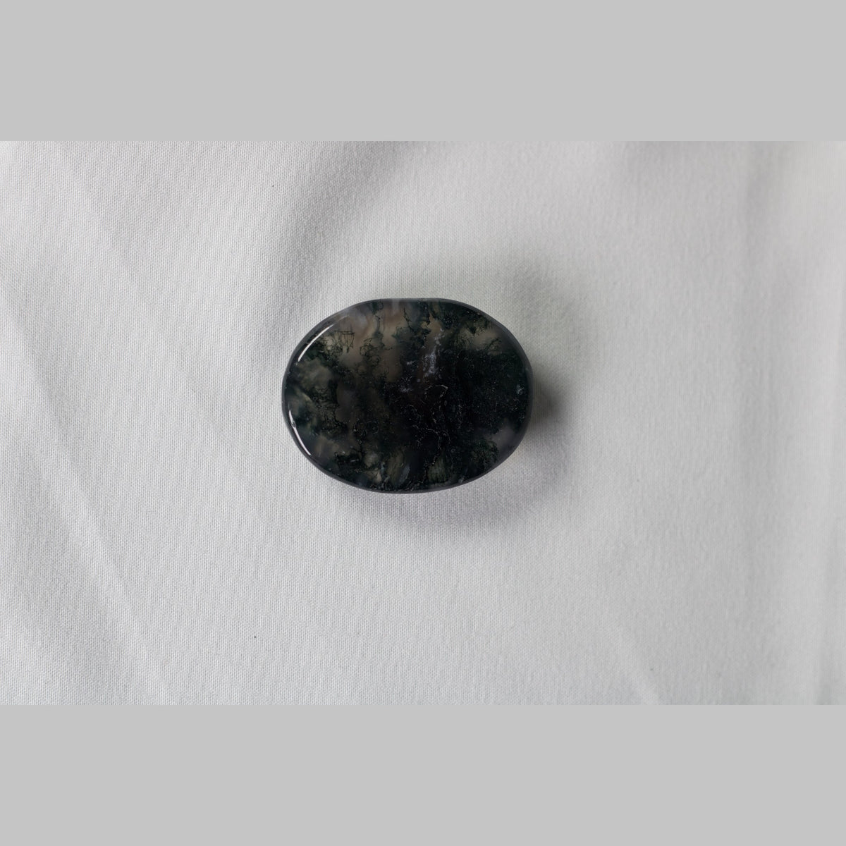 Unedited photo of the moss agate worry stone