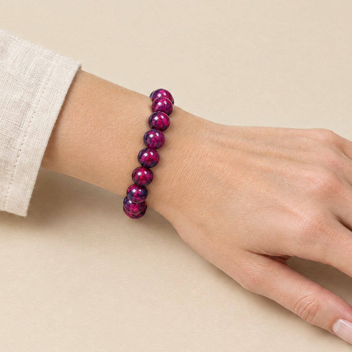 Purple onyx bracelet worn on a woman's wrist