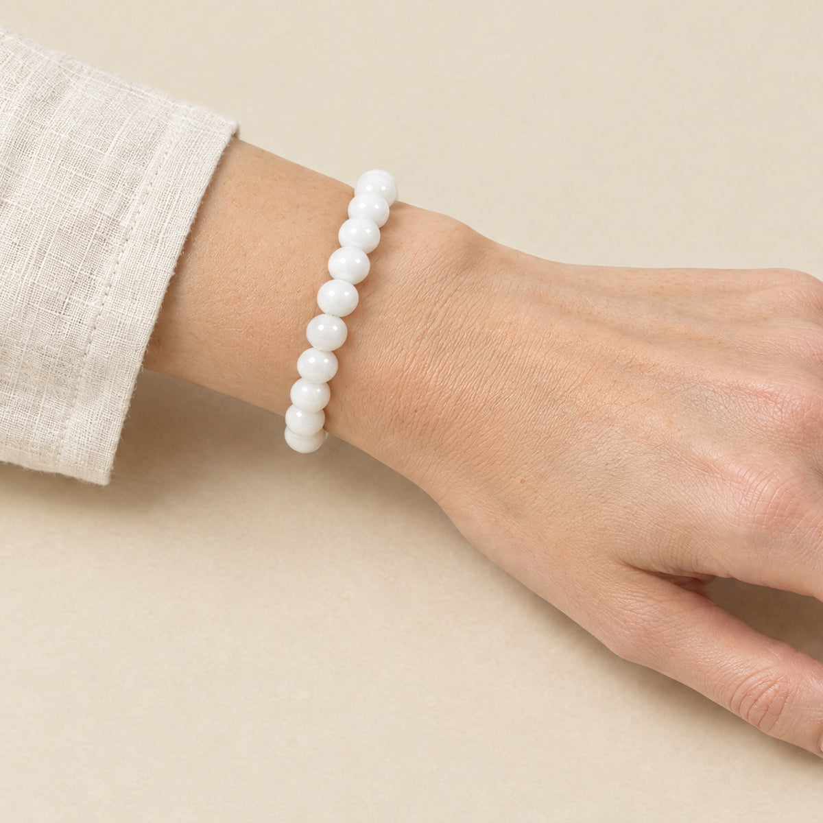 White onyx bracelet worn on a woman's wrist