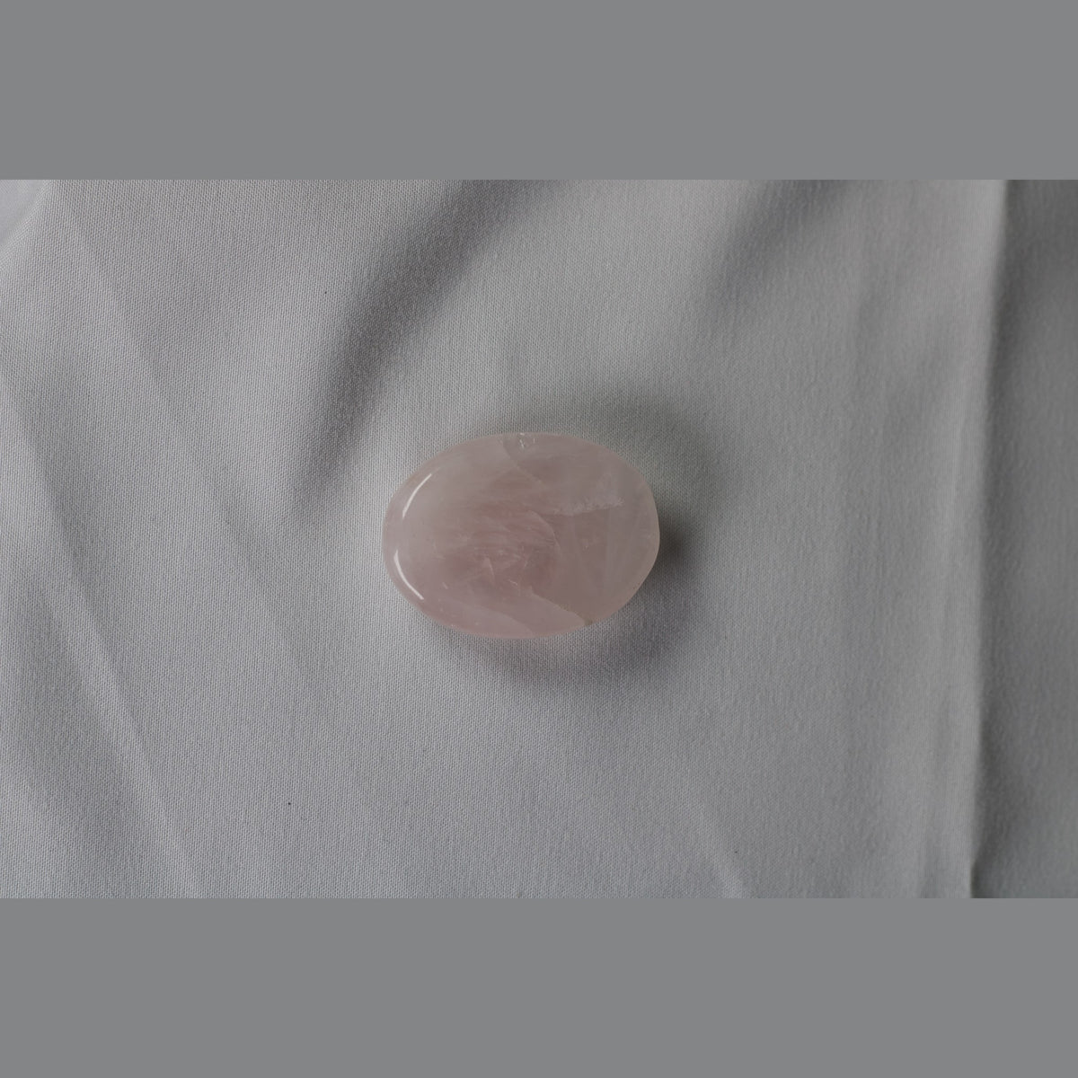 Unedited photo of the rose quartz worry stone
