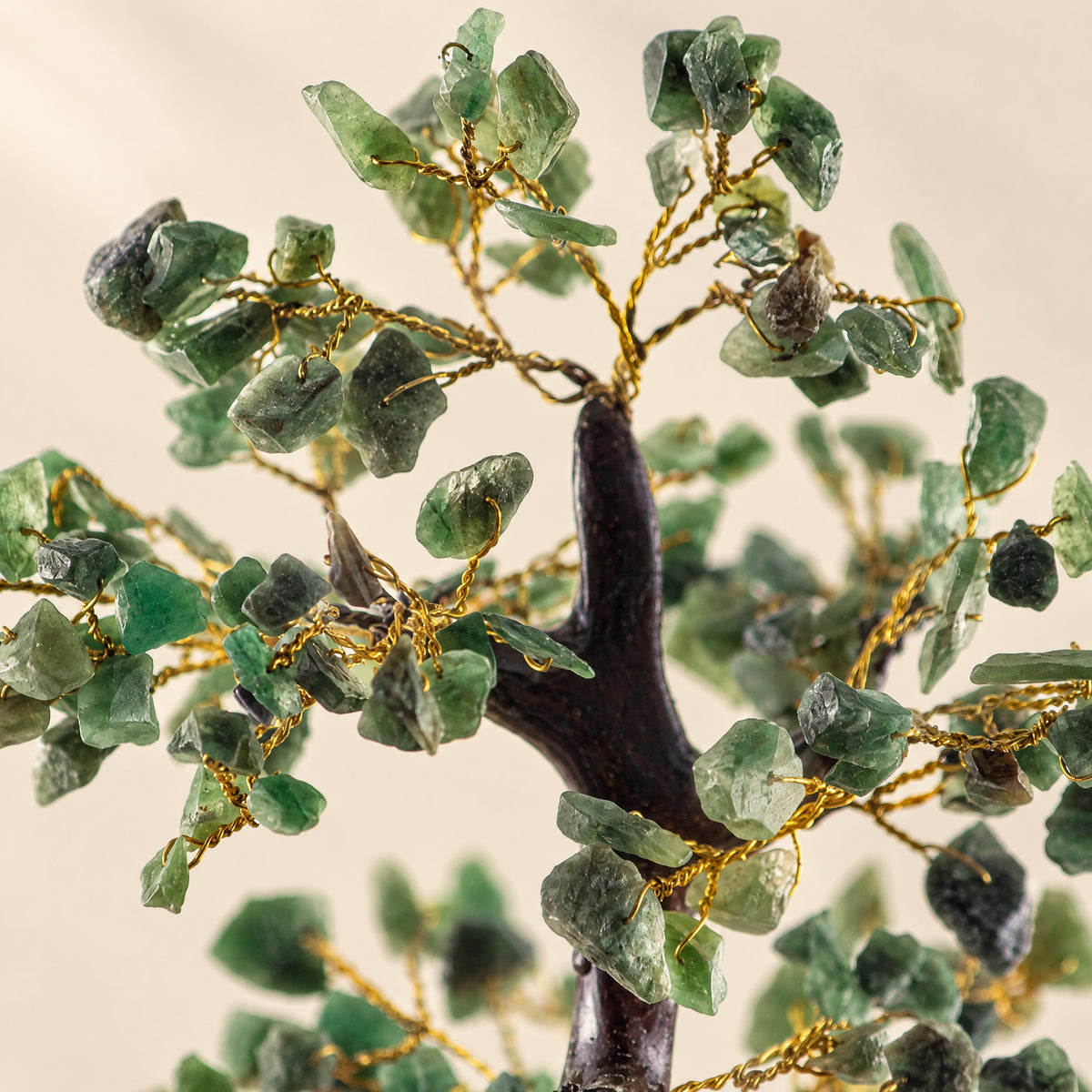 Close-up of the green aventurine chips on gold-tone wire branches
