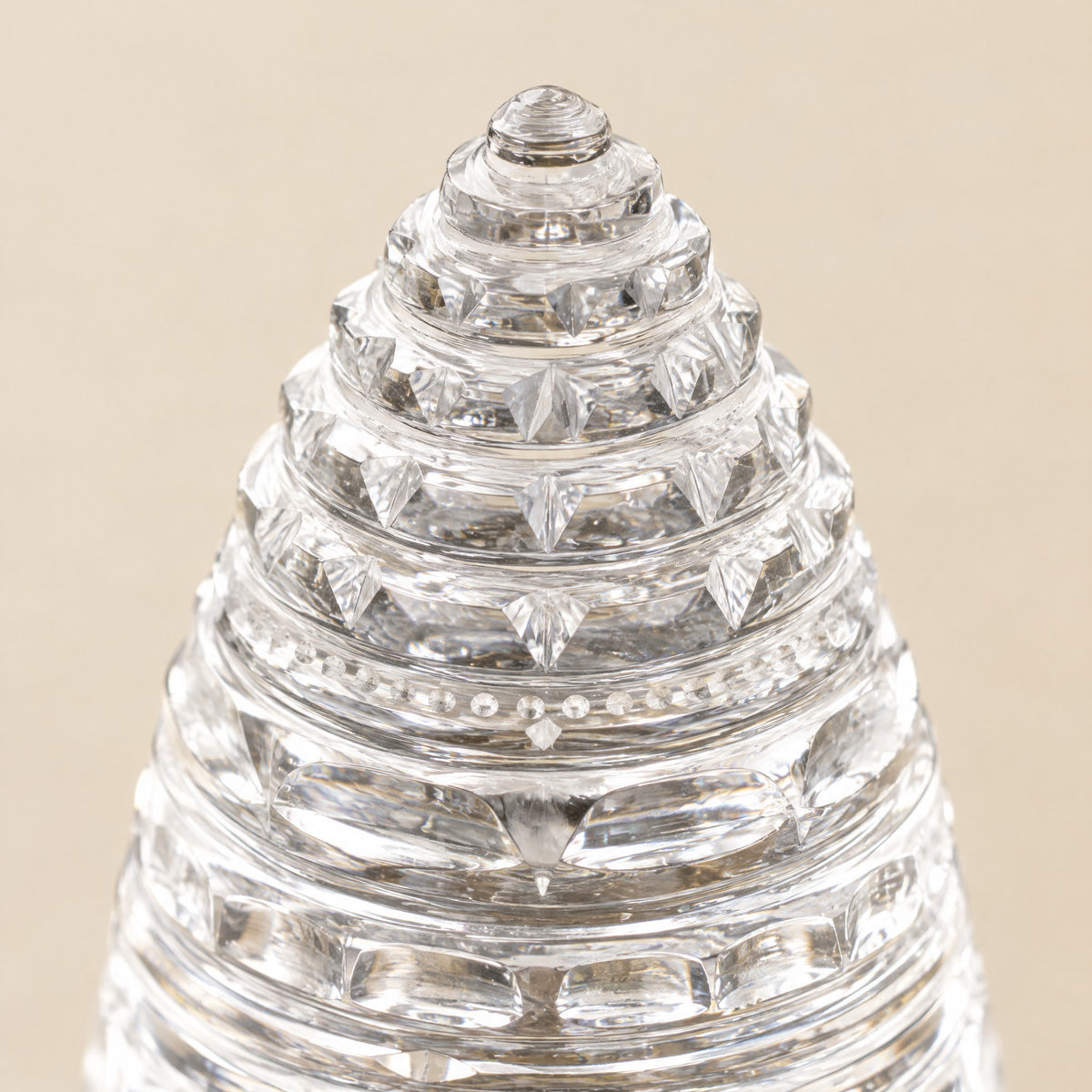 Close-up of the carved triangles and lotus tiers of the crystal quartz Sri Yantra