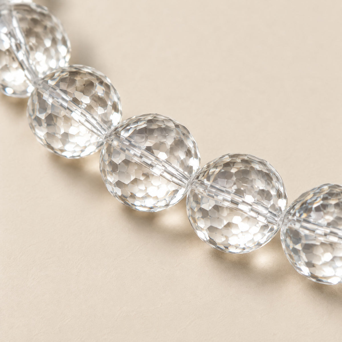 Close-up of the faceted clear quartz crystal beads