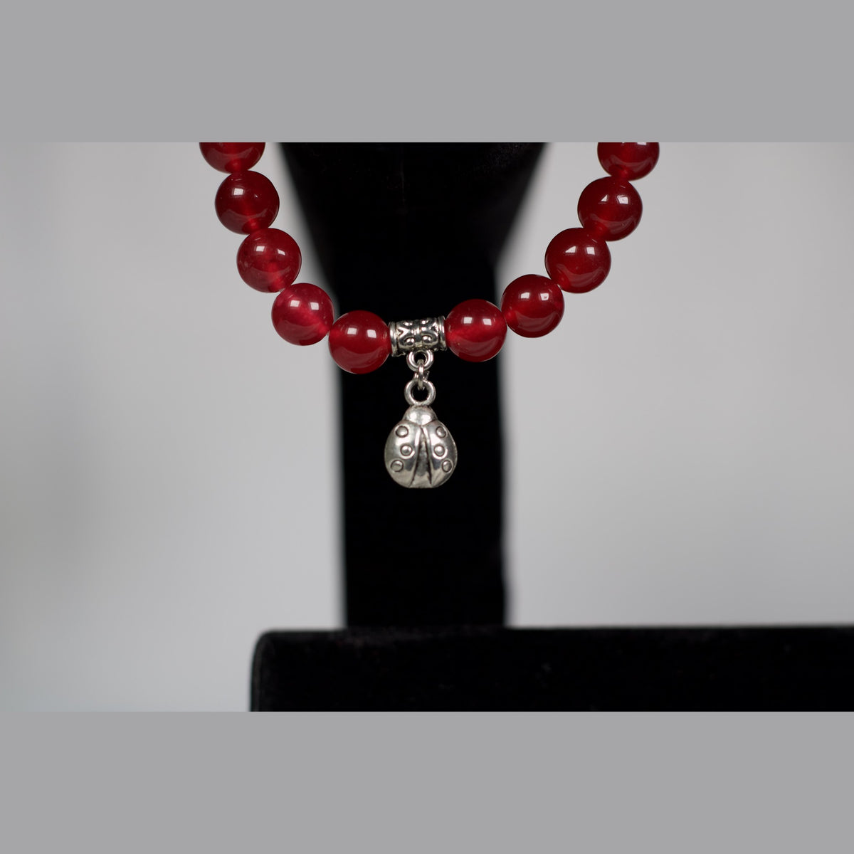 Unedited close-up of the ladybug charm