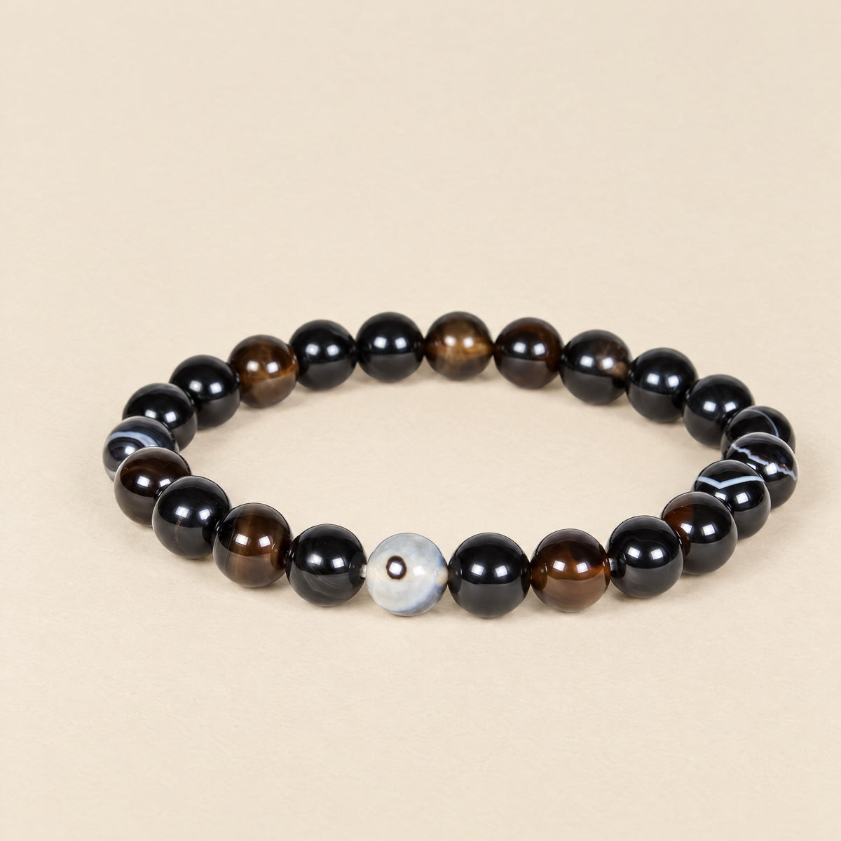 Sulemani agate bead bracelet, black and brown banded beads with one eye bead