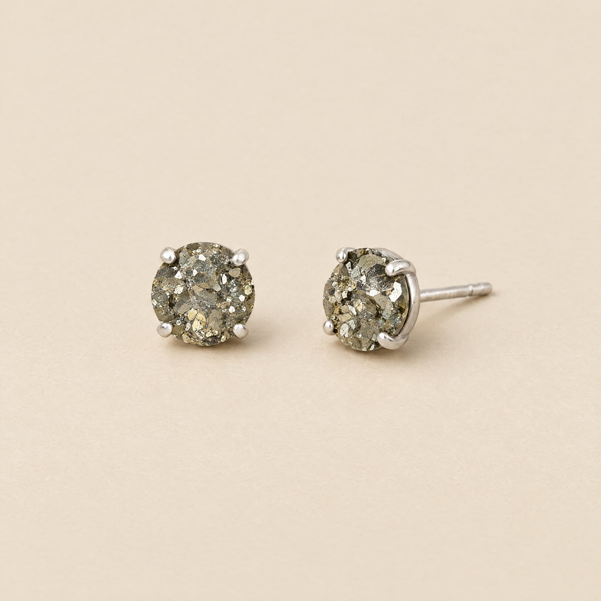 Round pyrite stud earrings in silver-tone settings
