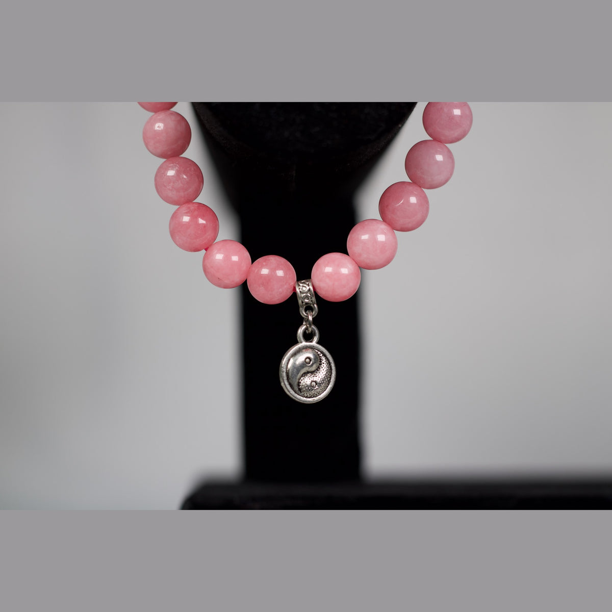 Unedited close-up of the yin yang charm