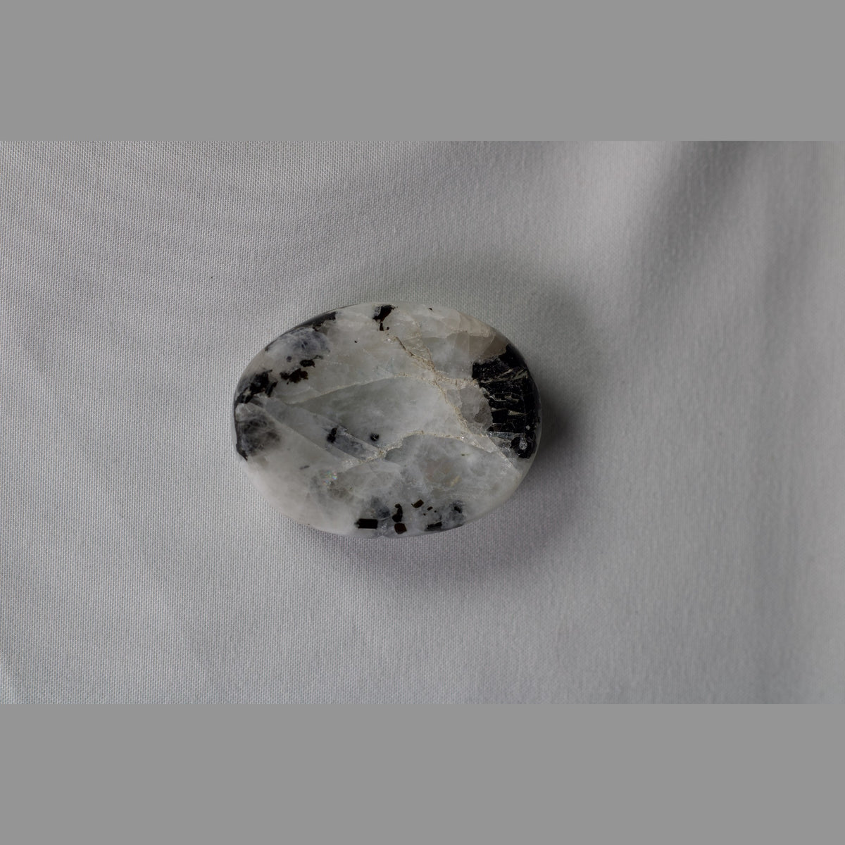Unedited photo of the white moonstone worry stone