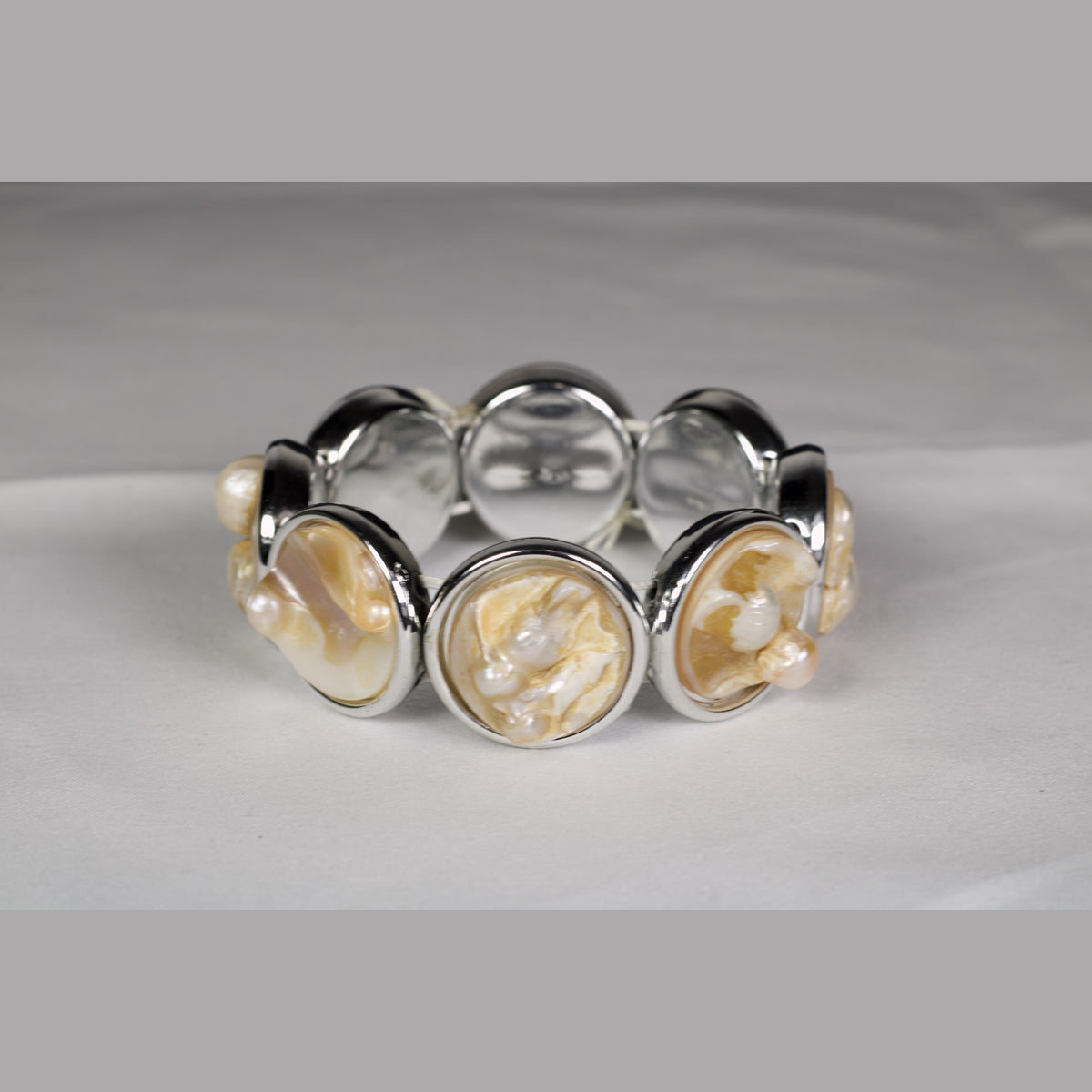 Unedited photo of the mother of pearl & freshwater pearl bracelet