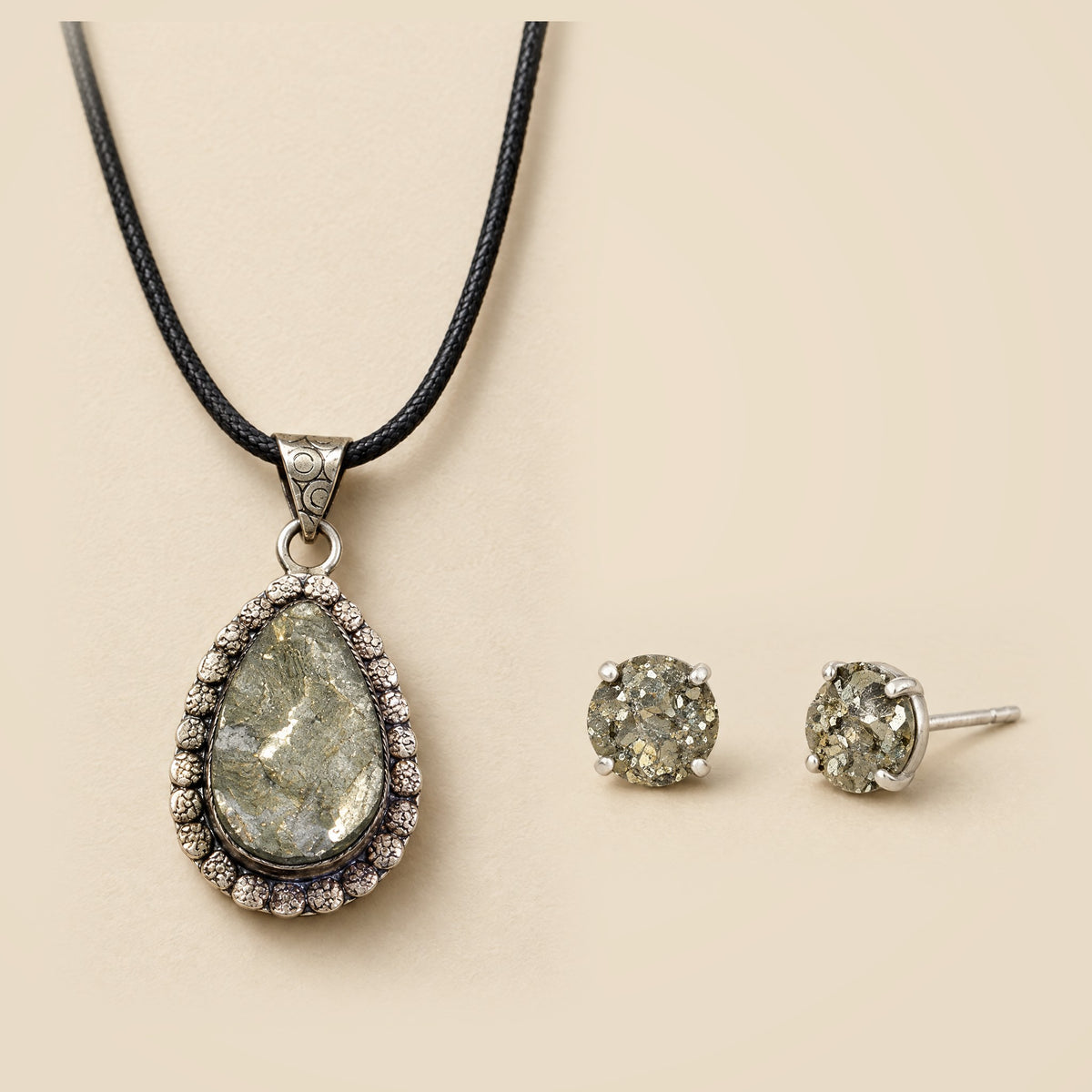 Pyrite jewelry set: teardrop pendant on black cord and matching stud earrings