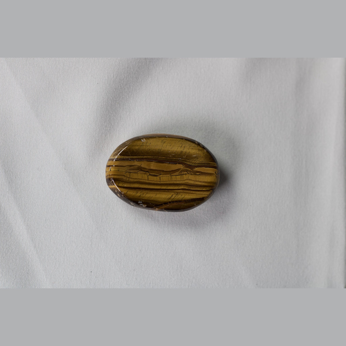Unedited photo of the tiger eye worry stone