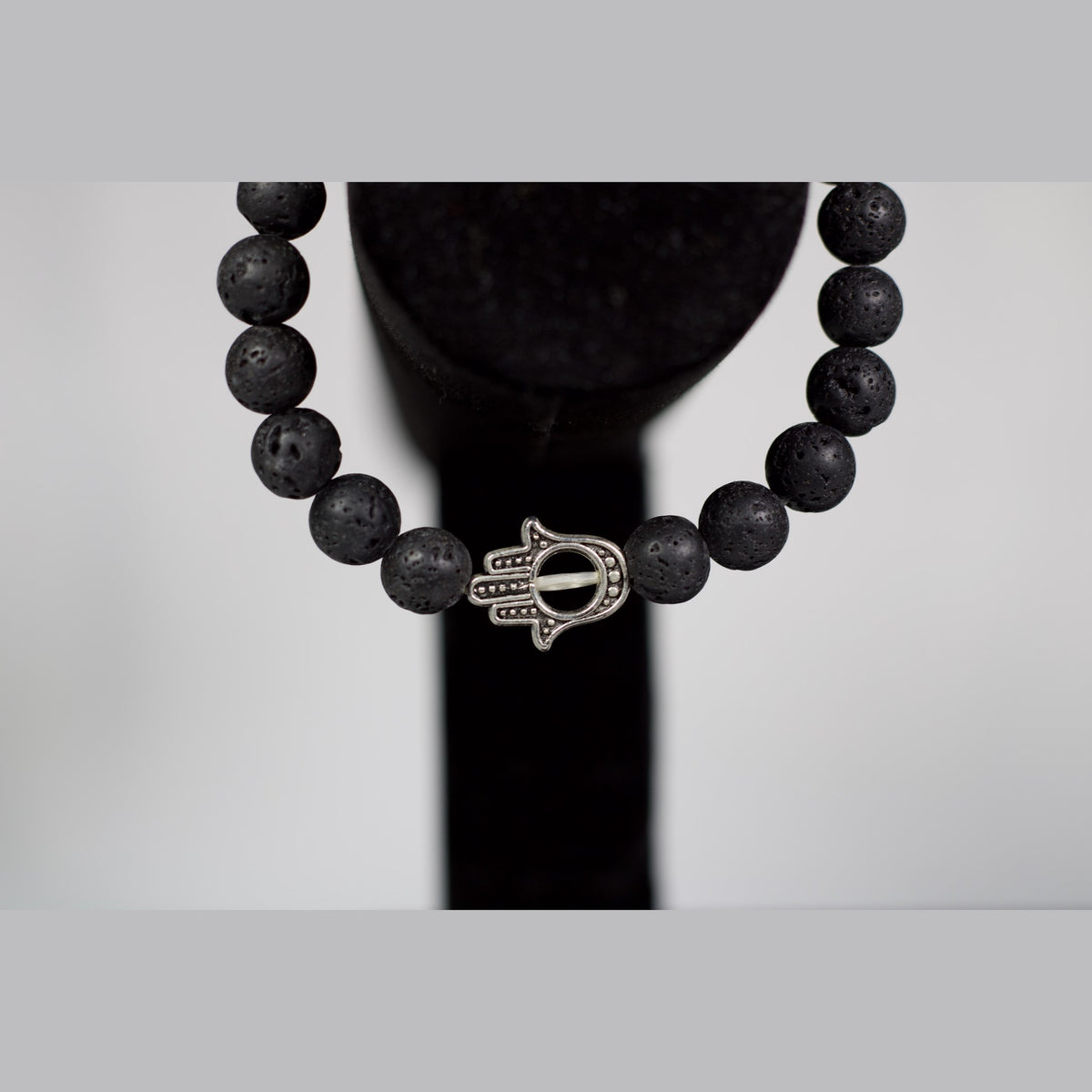 Unedited close-up of the Hamsa hand charm