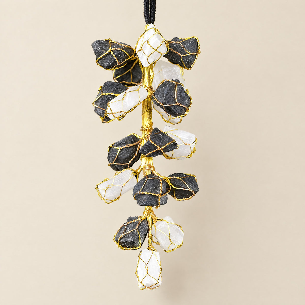 Selenite & Black Tourmaline Hanging: selenite and black tourmaline pieces in gold-tone wire