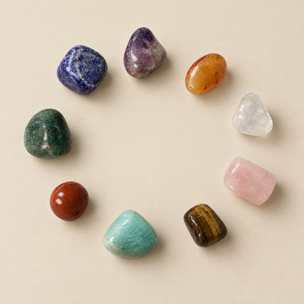 Nine polished tumbled stones: lapis, amethyst, carnelian, clear quartz, rose quartz, tiger eye, amazonite, red jasper, green aventurine