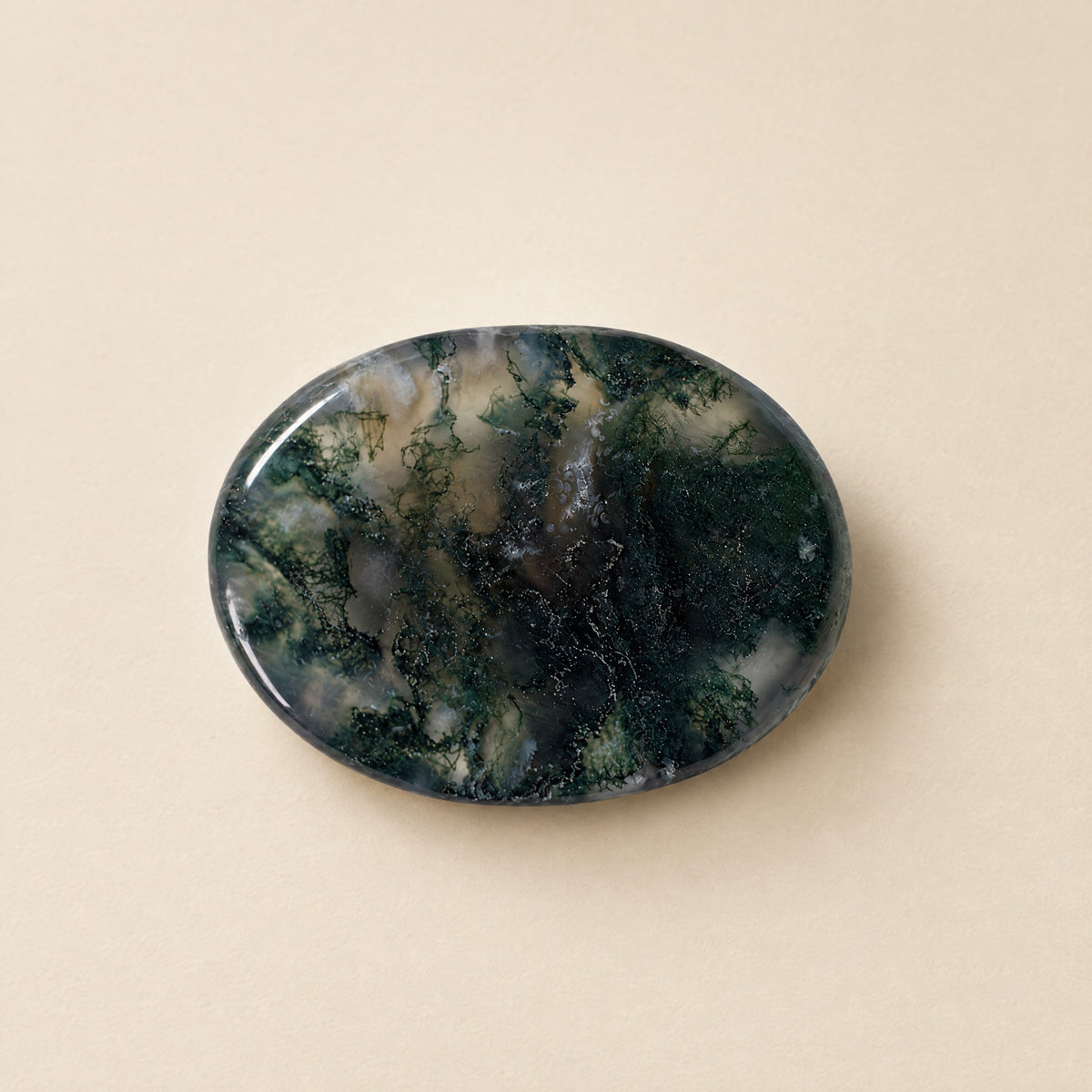 Polished moss agate worry stone with thumb dip