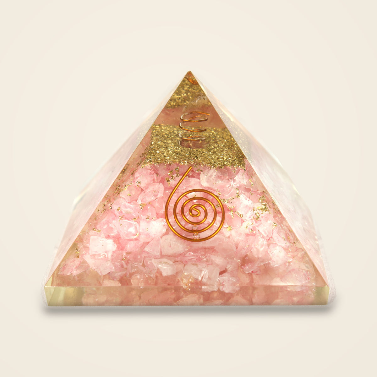 Rose quartz orgone pyramid with gold-tone flakes and copper-tone spiral