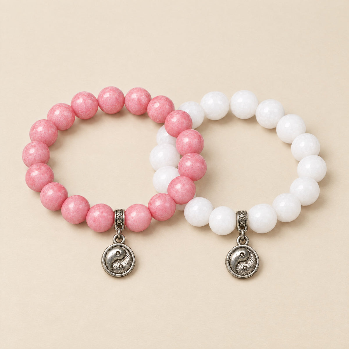 Yin Yang BFF pair: pink onyx and white onyx charm bracelets
